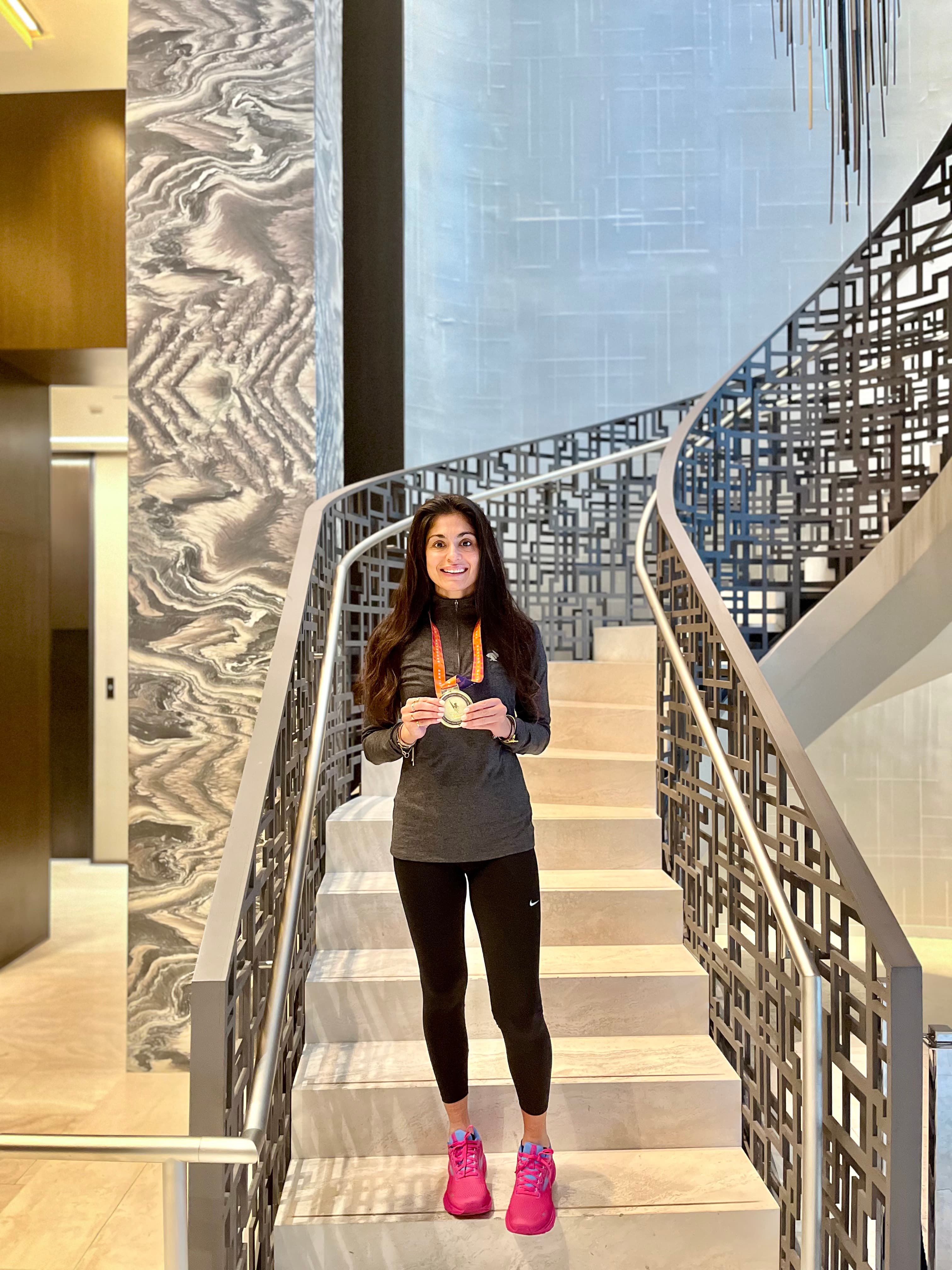 Posing for a photo with a medal