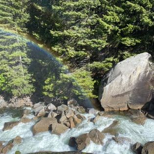 Beautiful view of rainbow in water stream