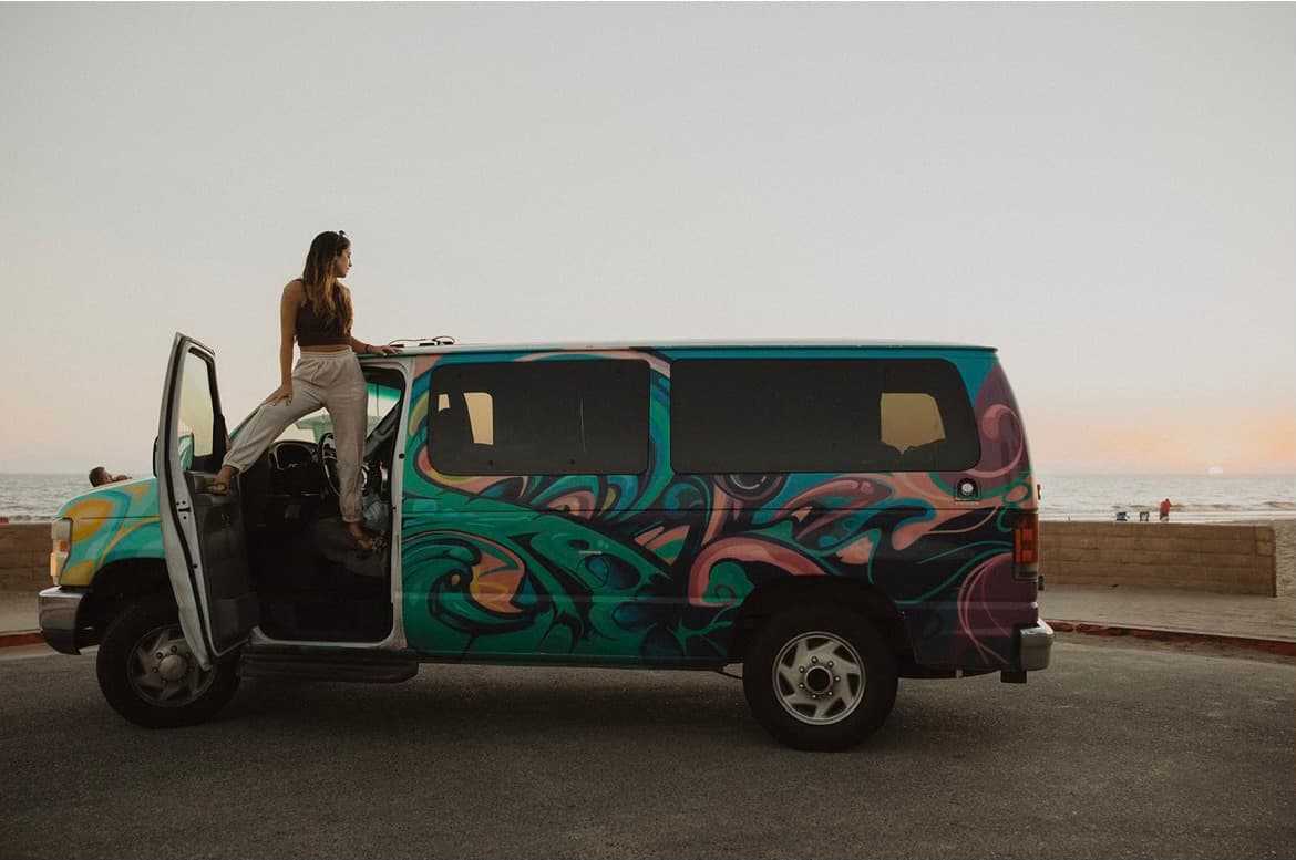 Standing in the door of the van