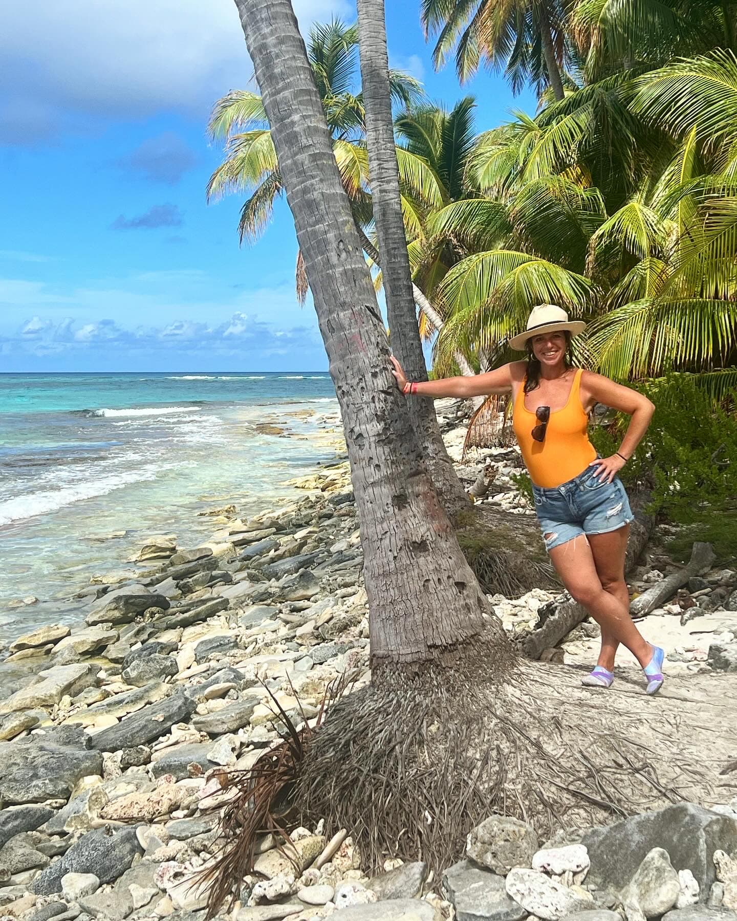 Posing for a photo by the tree