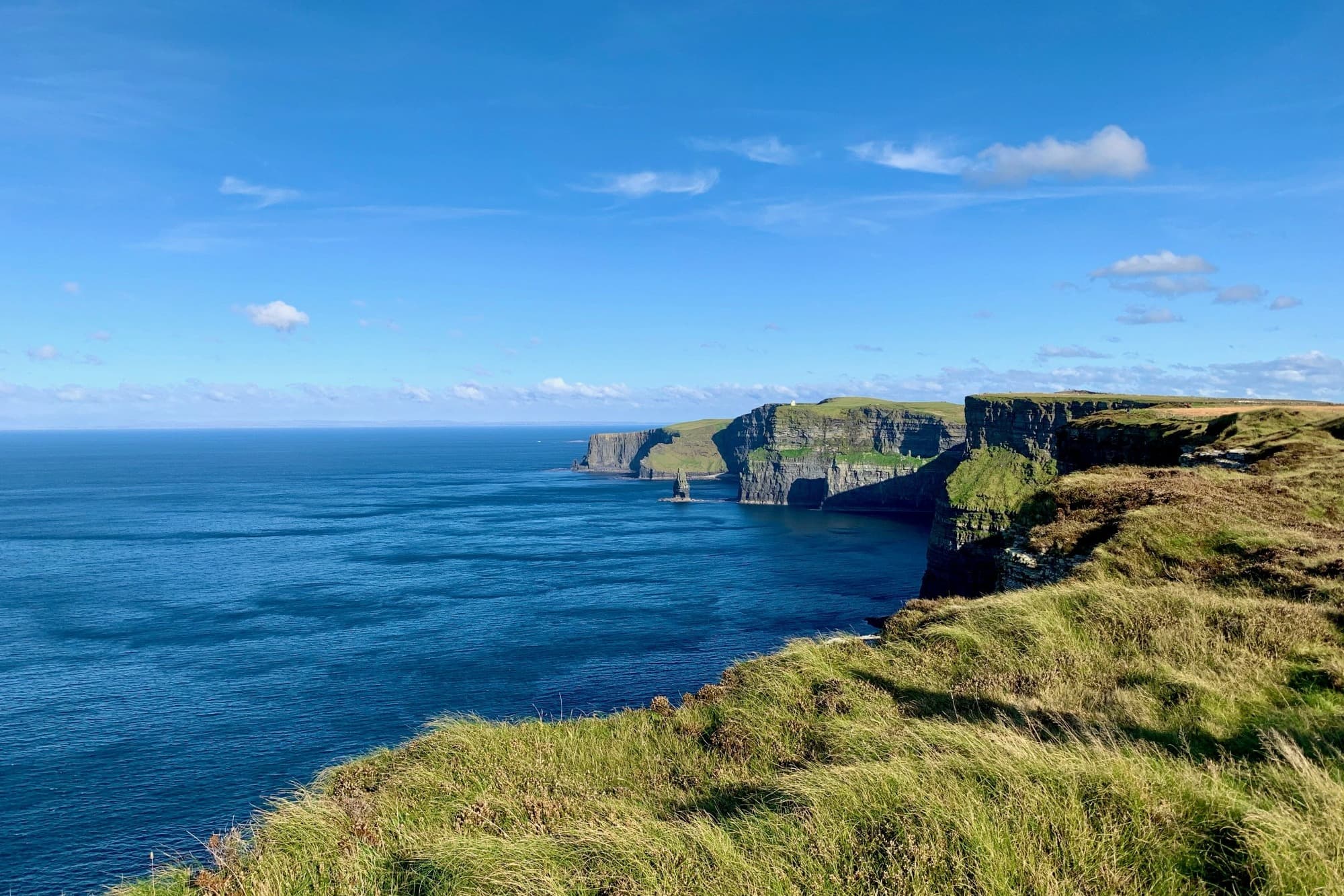 rugged green cliffs by the sea