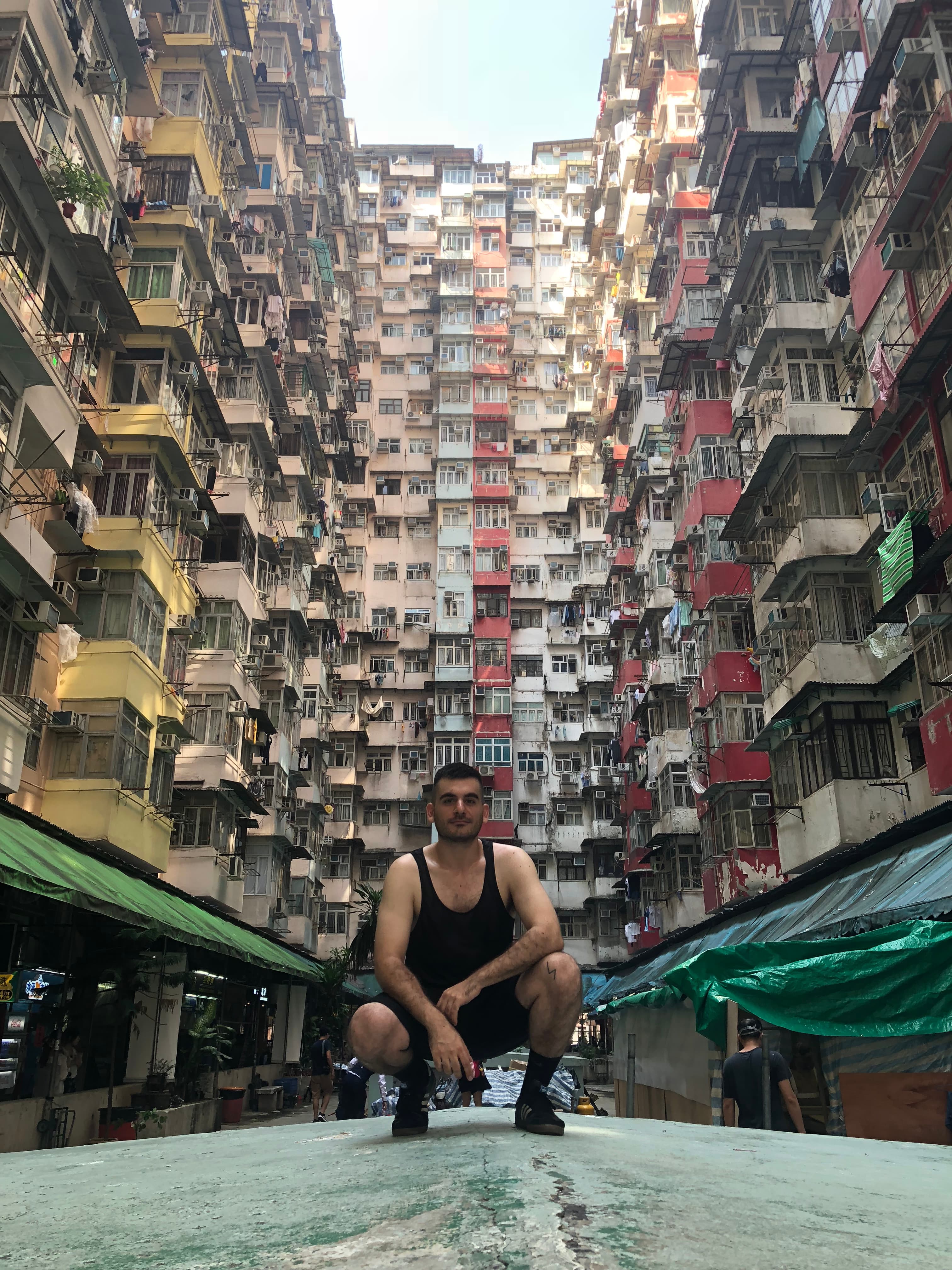 Posing for a picture in an apartment complex