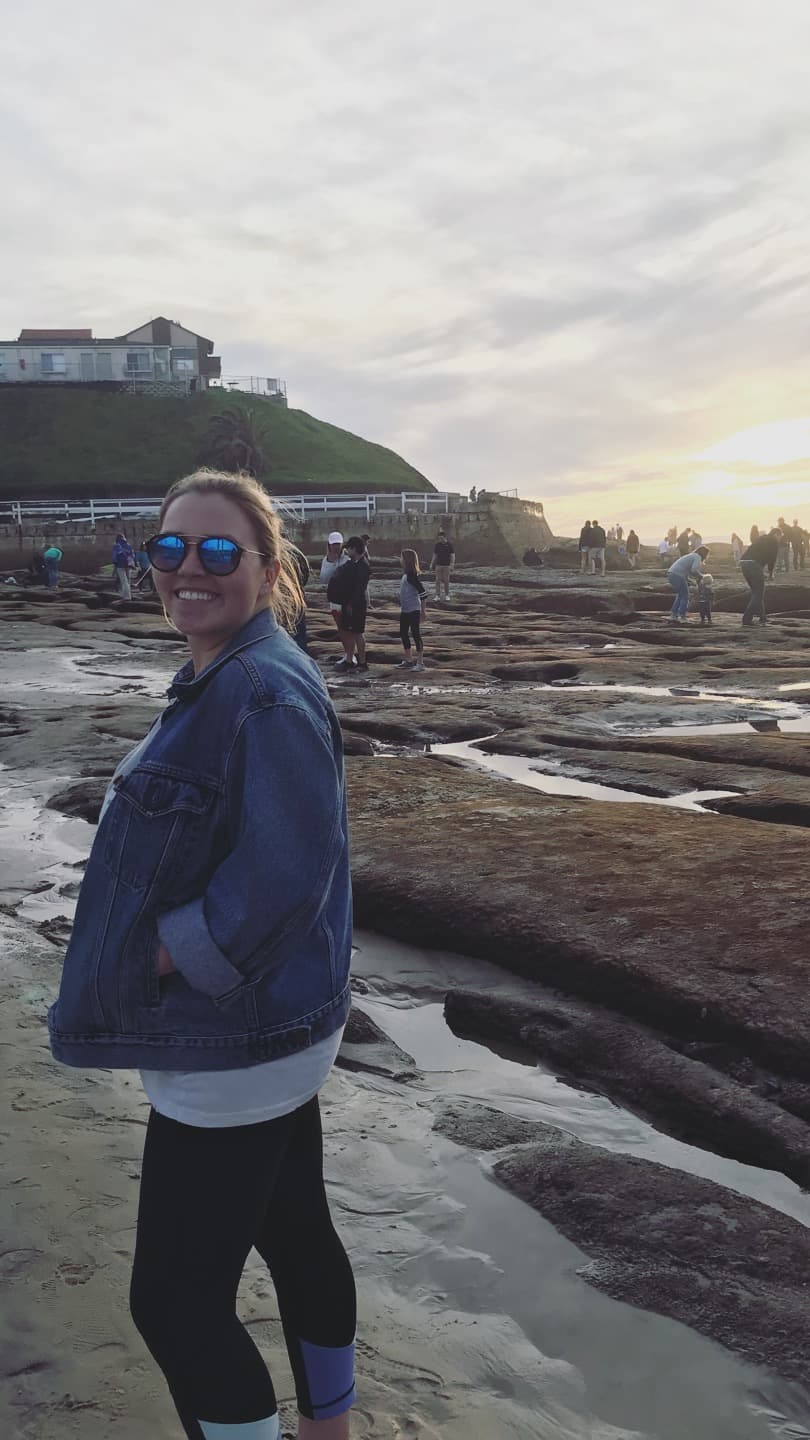 Wearing a denim jacket and sunglasses