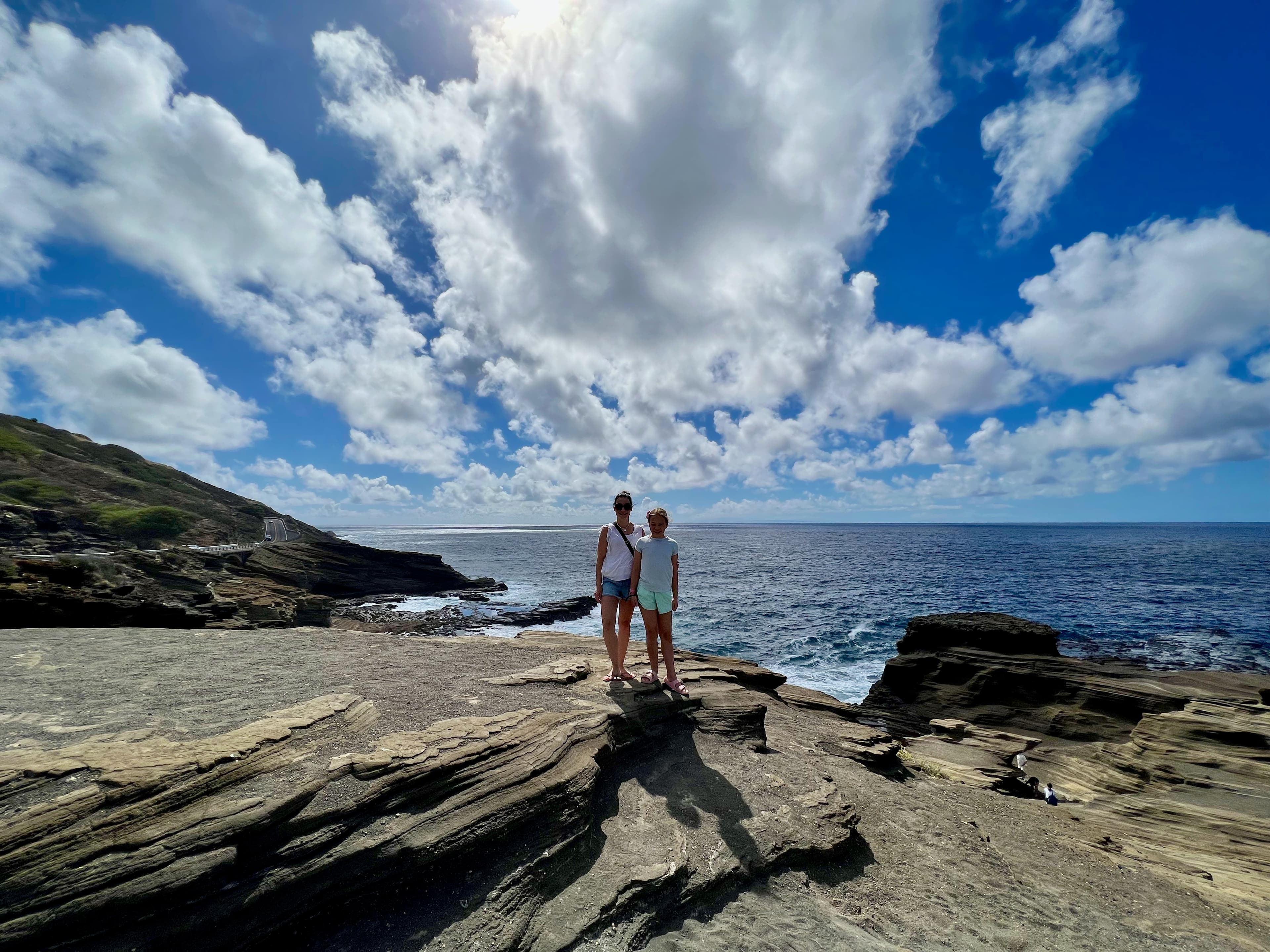 Picture of Jaclyn standing on rock with beautiful sea view