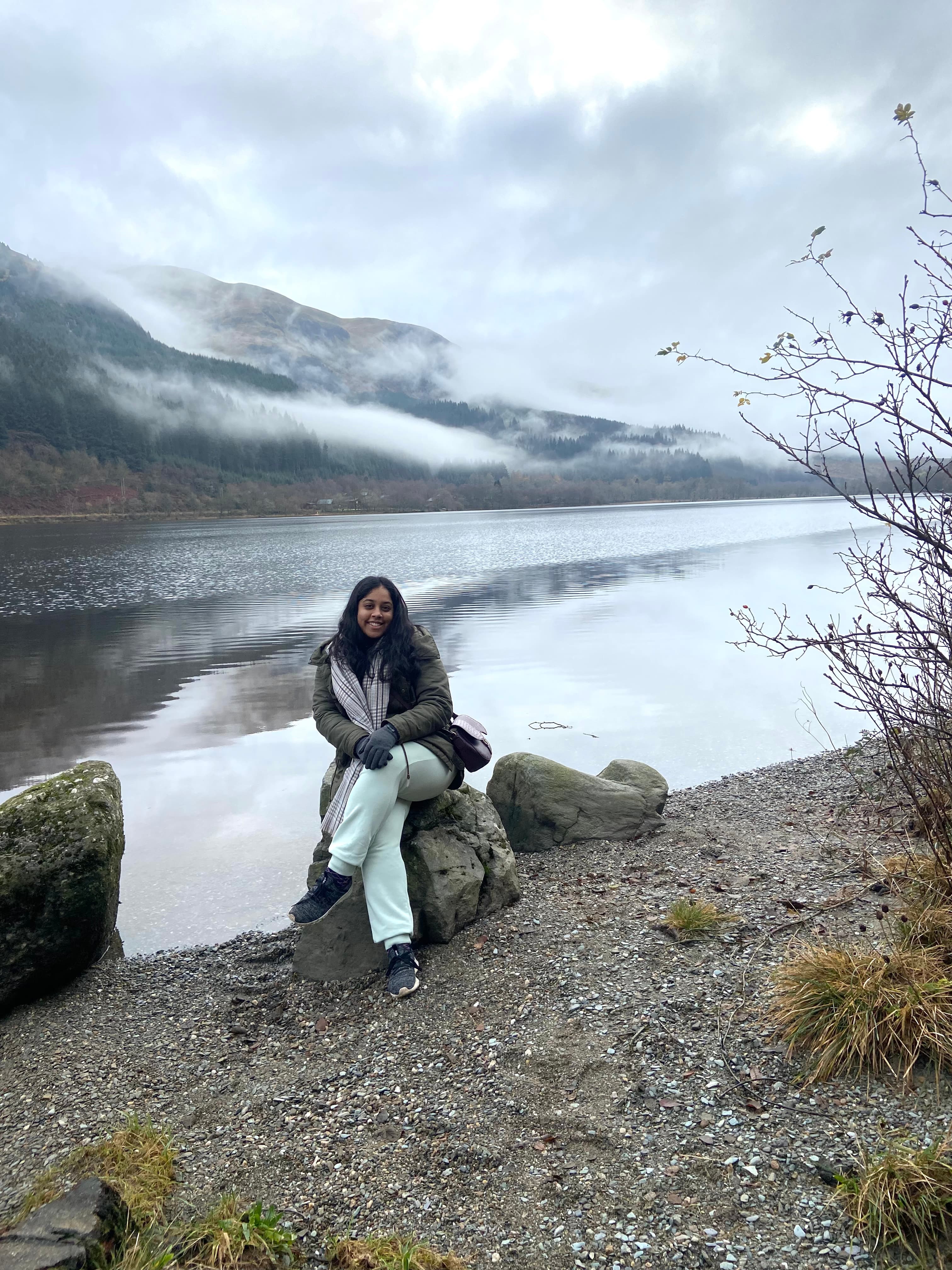 Sitting on the rock by the lake