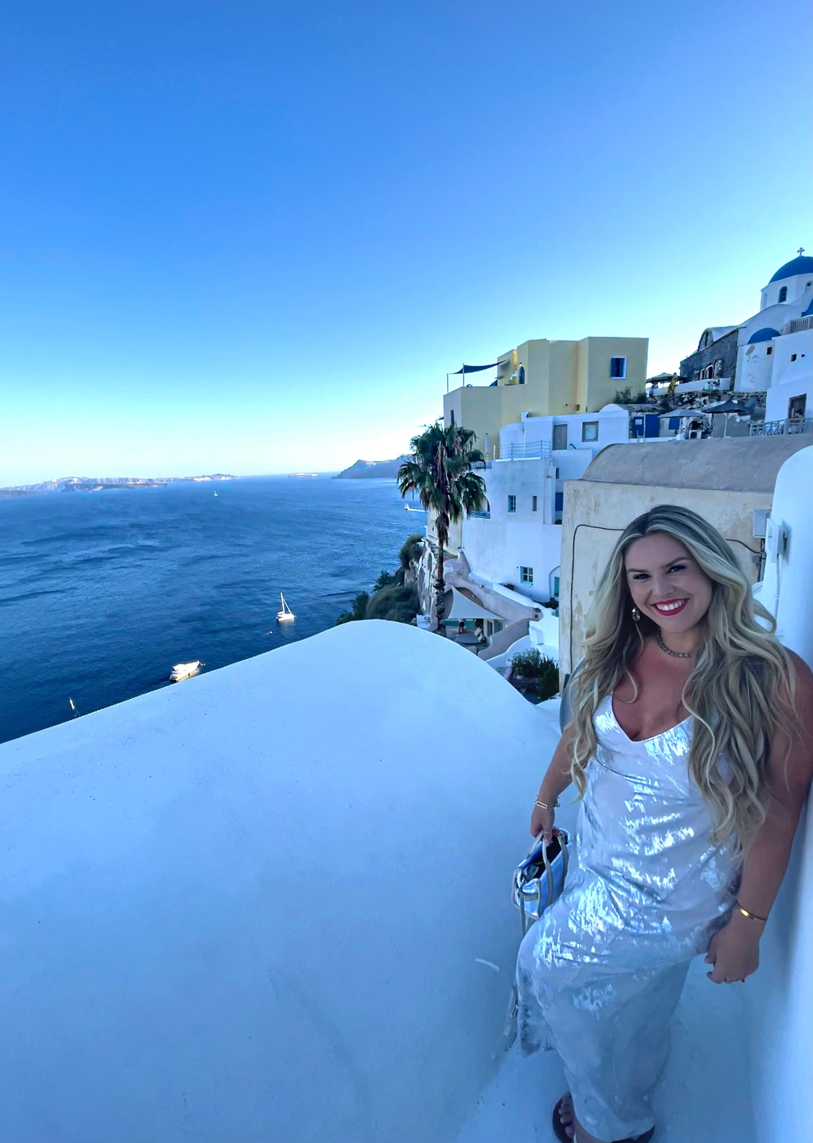Posing for a picture in Santorini