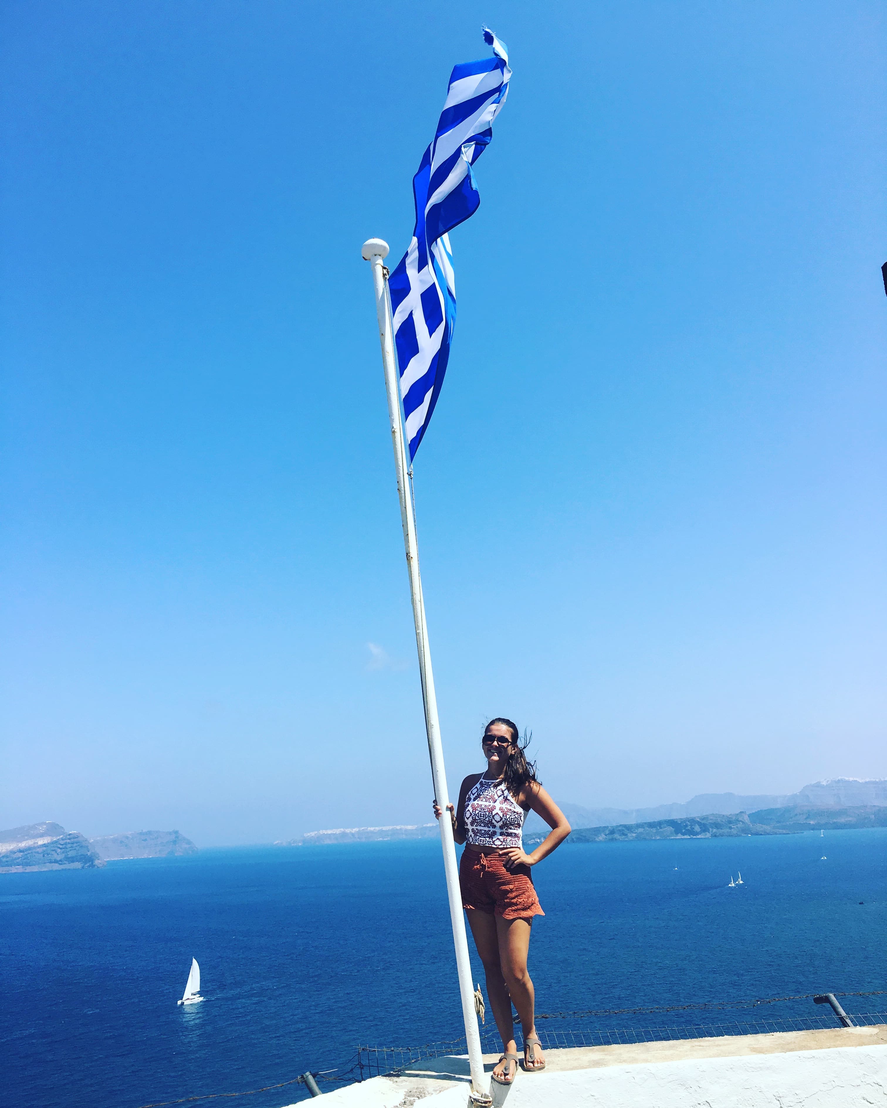 Posing for a picture with Greek flag