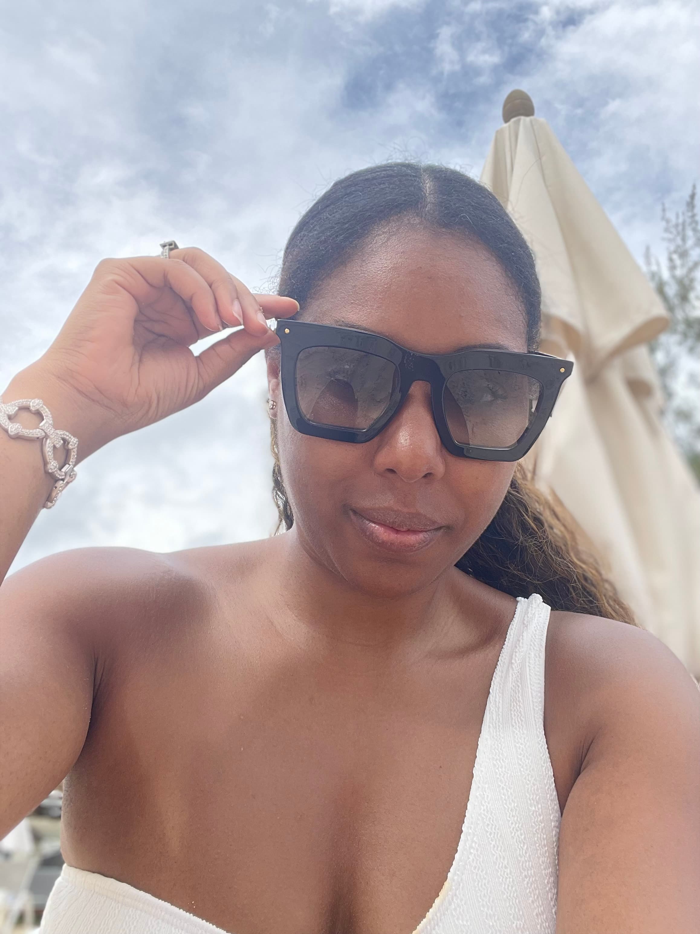 Picture of Lynnett in white dress in sunglasses