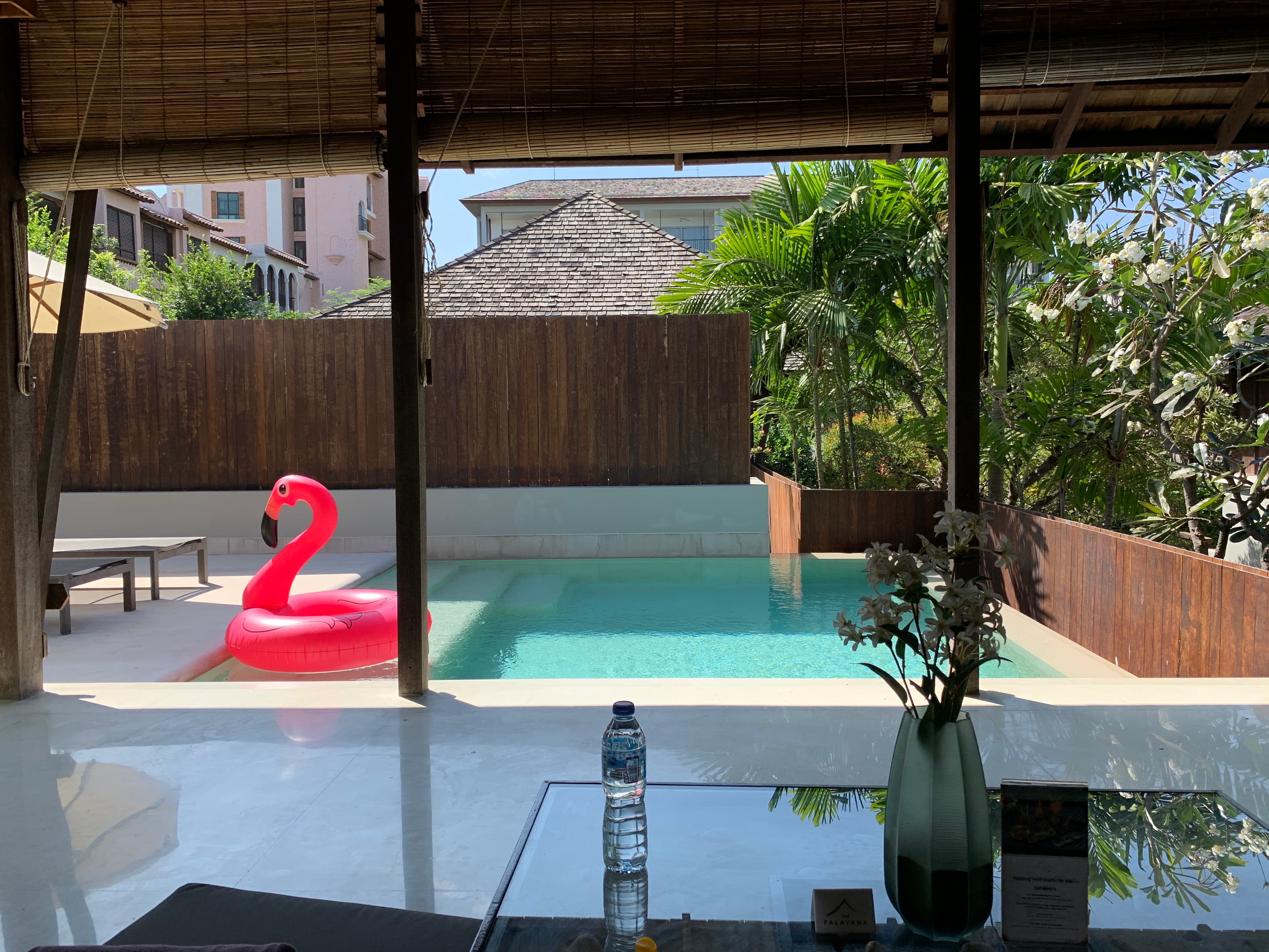 Pink flamingo floater in the pool