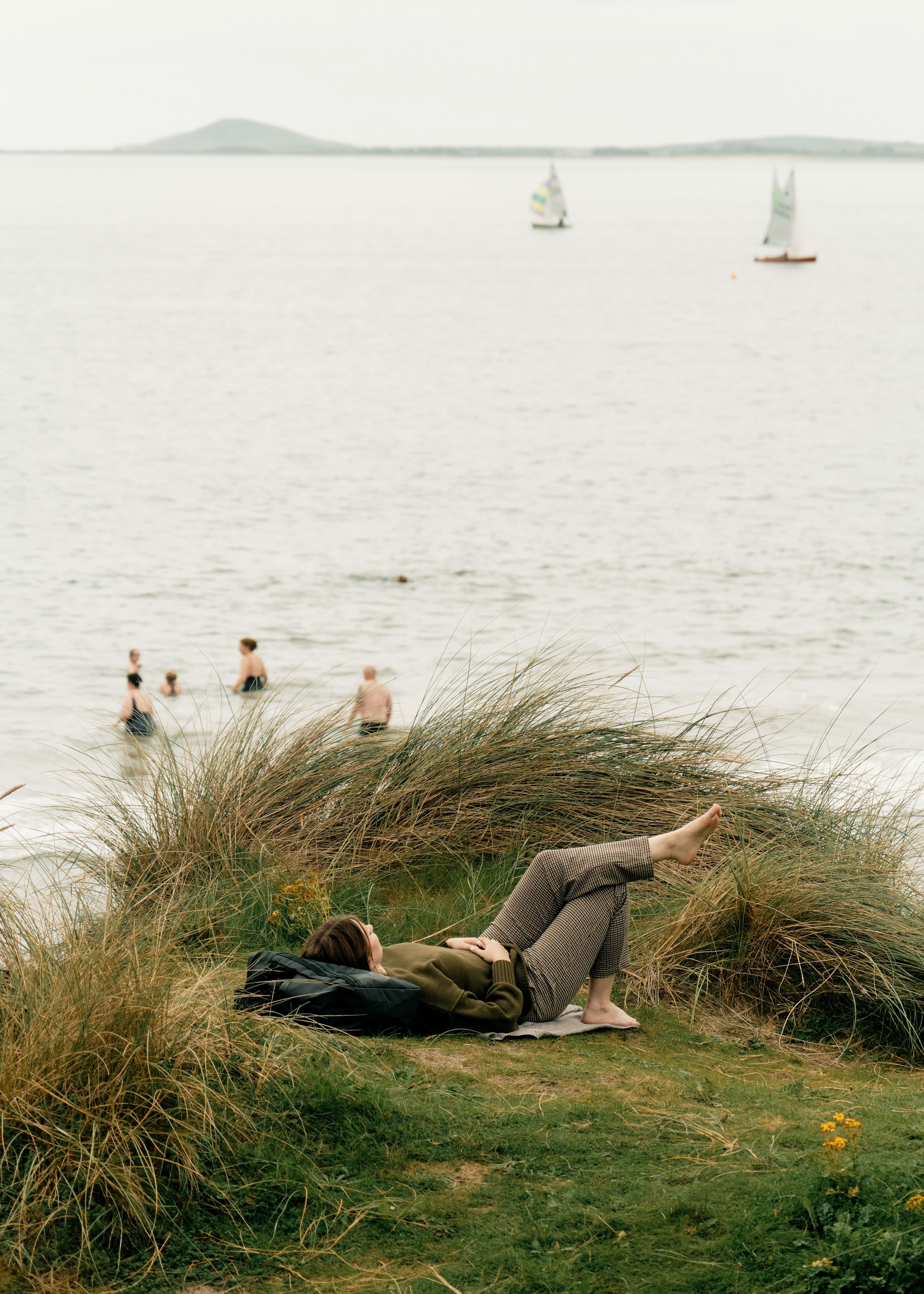 Picture of Hannah lying on grass