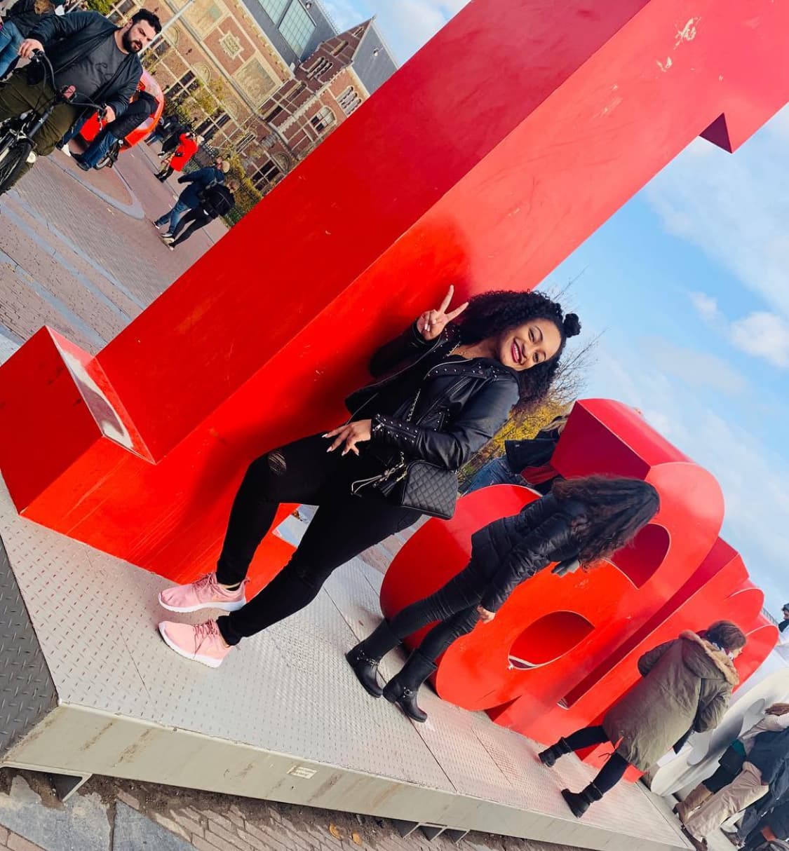 Posing for a picture with I amsterdam Sign