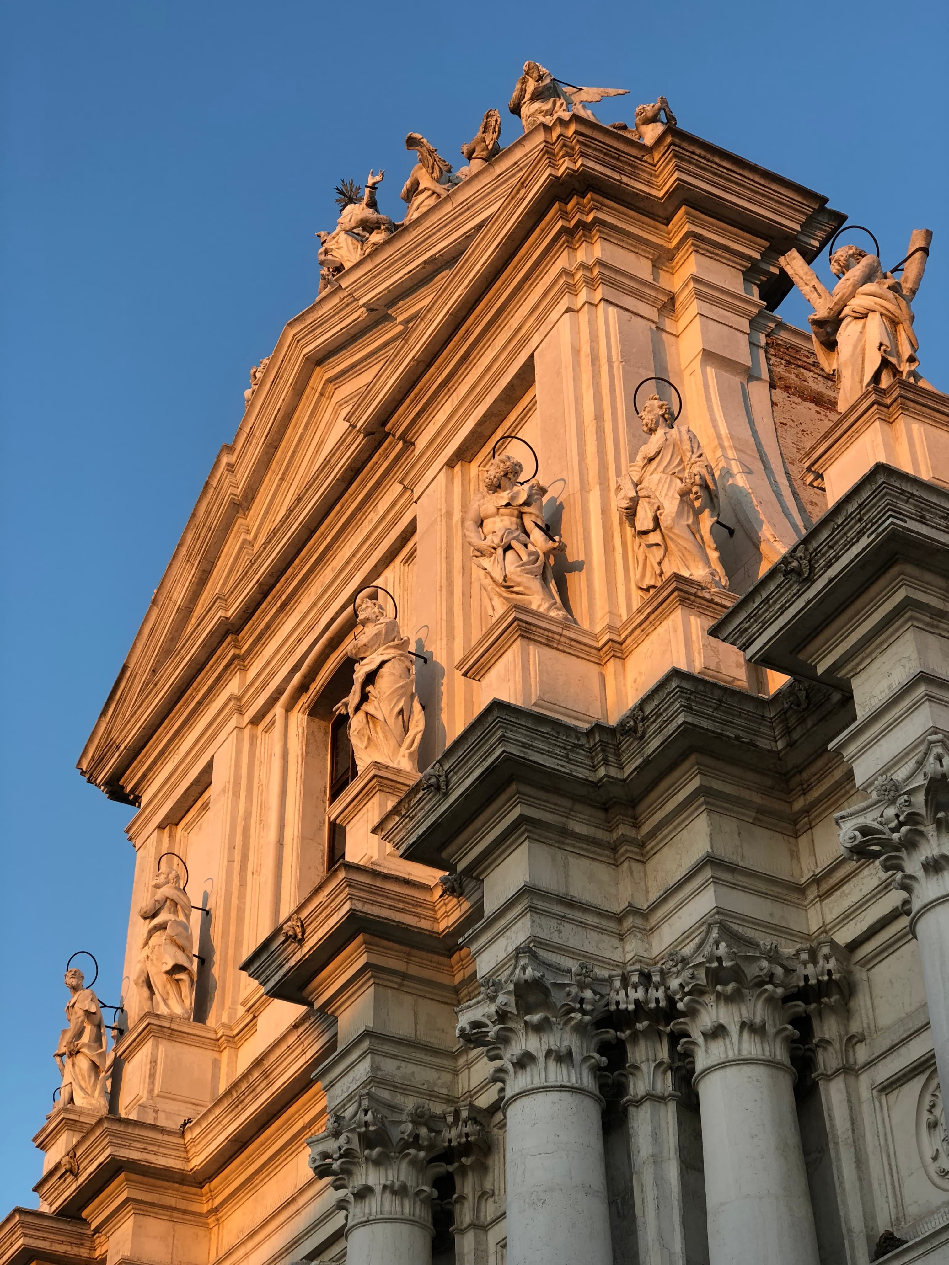 A beautiful view of an ancient structure that is adorned with miniature statues.