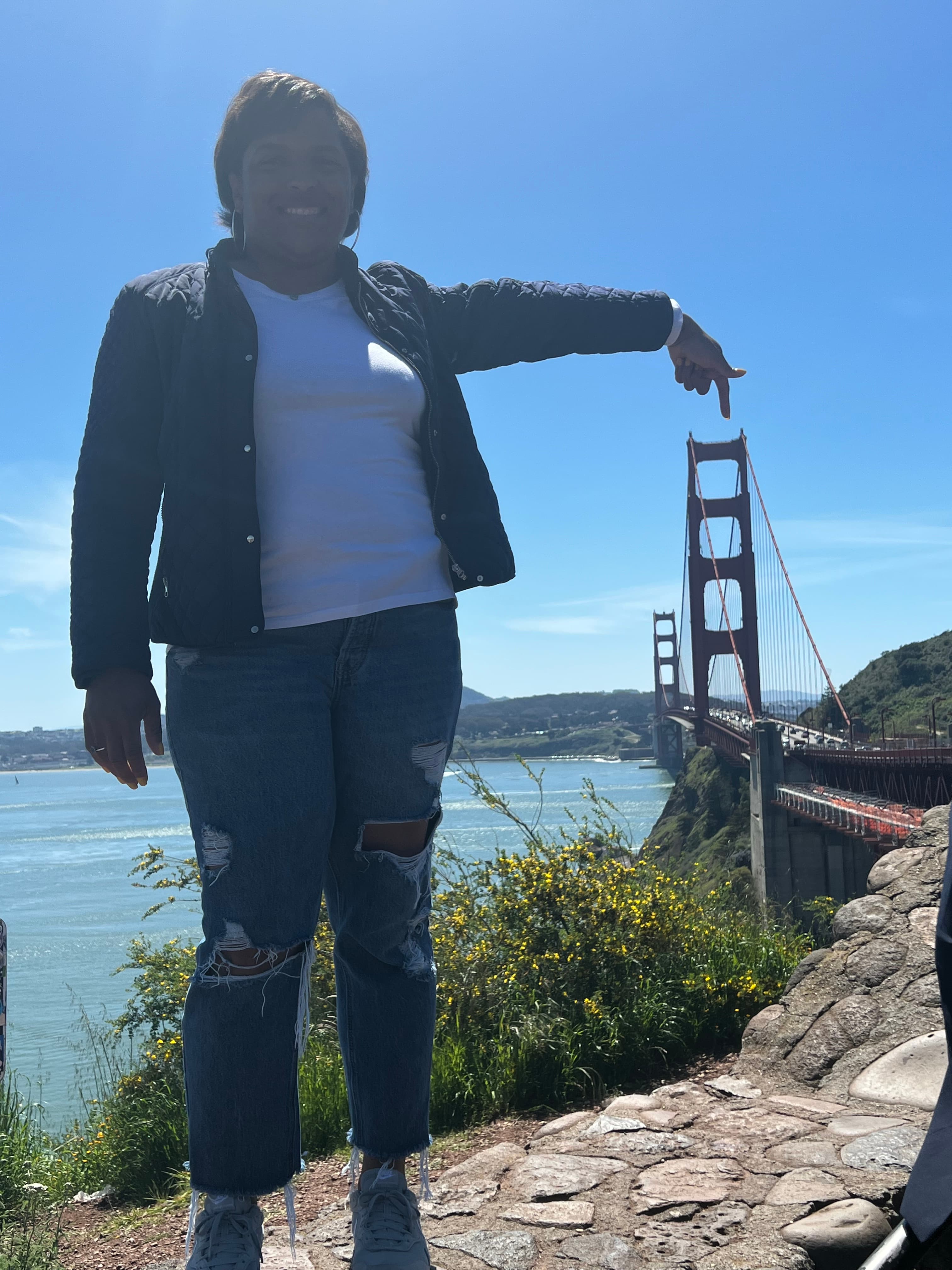 Posing for a picture with view of Golden Gate Bridge