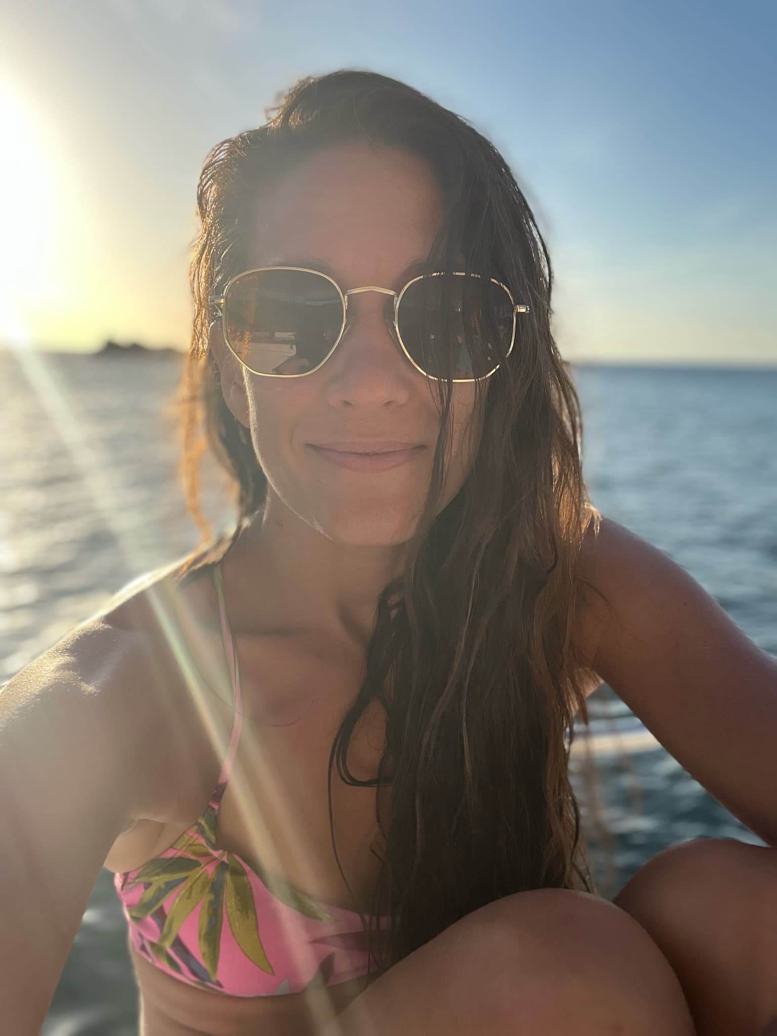 Posing for a picture wearing sunglasses