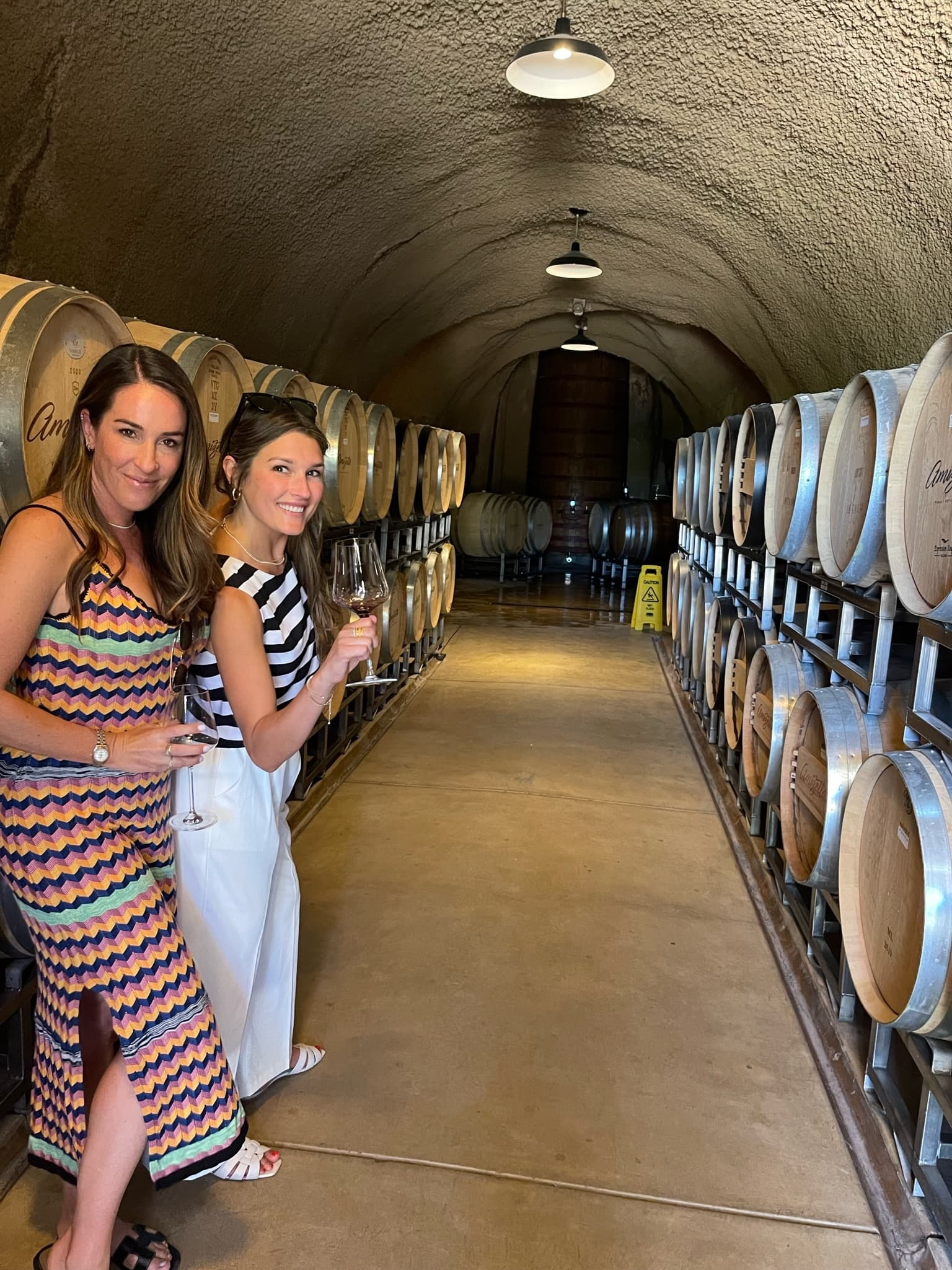 Picture of Maggie with a friend tasting wine