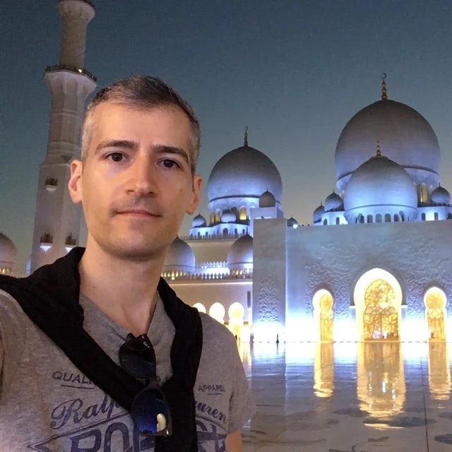 Travel Advisor Steve Michailidis in front of the white grand mosque.