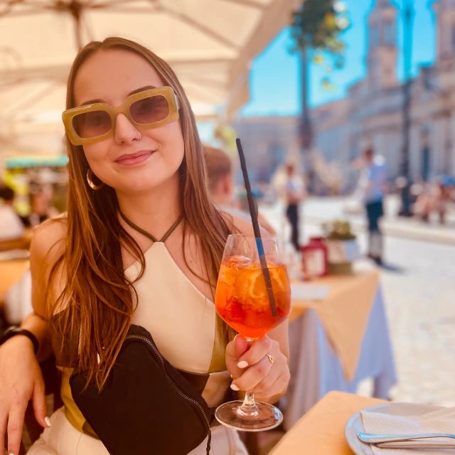 Travel advisor Kaetlin Fehl sips an Aperol spritz during a European vacation.
