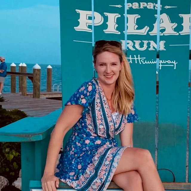 travel advisor Amanda Opalewski with blonde hair in a blue dress 