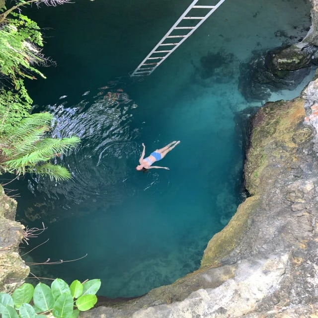 Aerial view of woman swimming in the Blue Hole, Jamaica