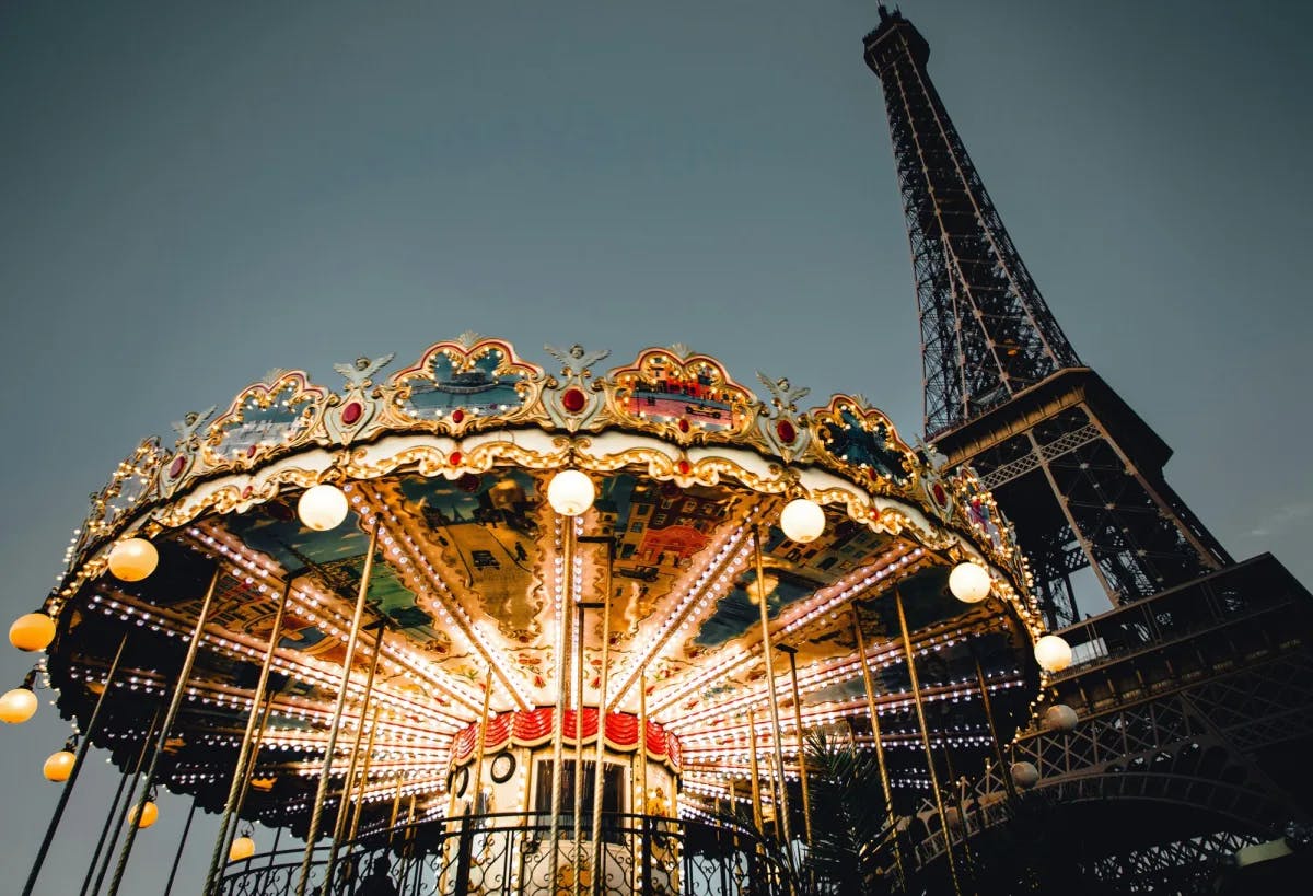 A carousel in front of the Eiffel Tower on the last day of a Paris 4–day itinerary.