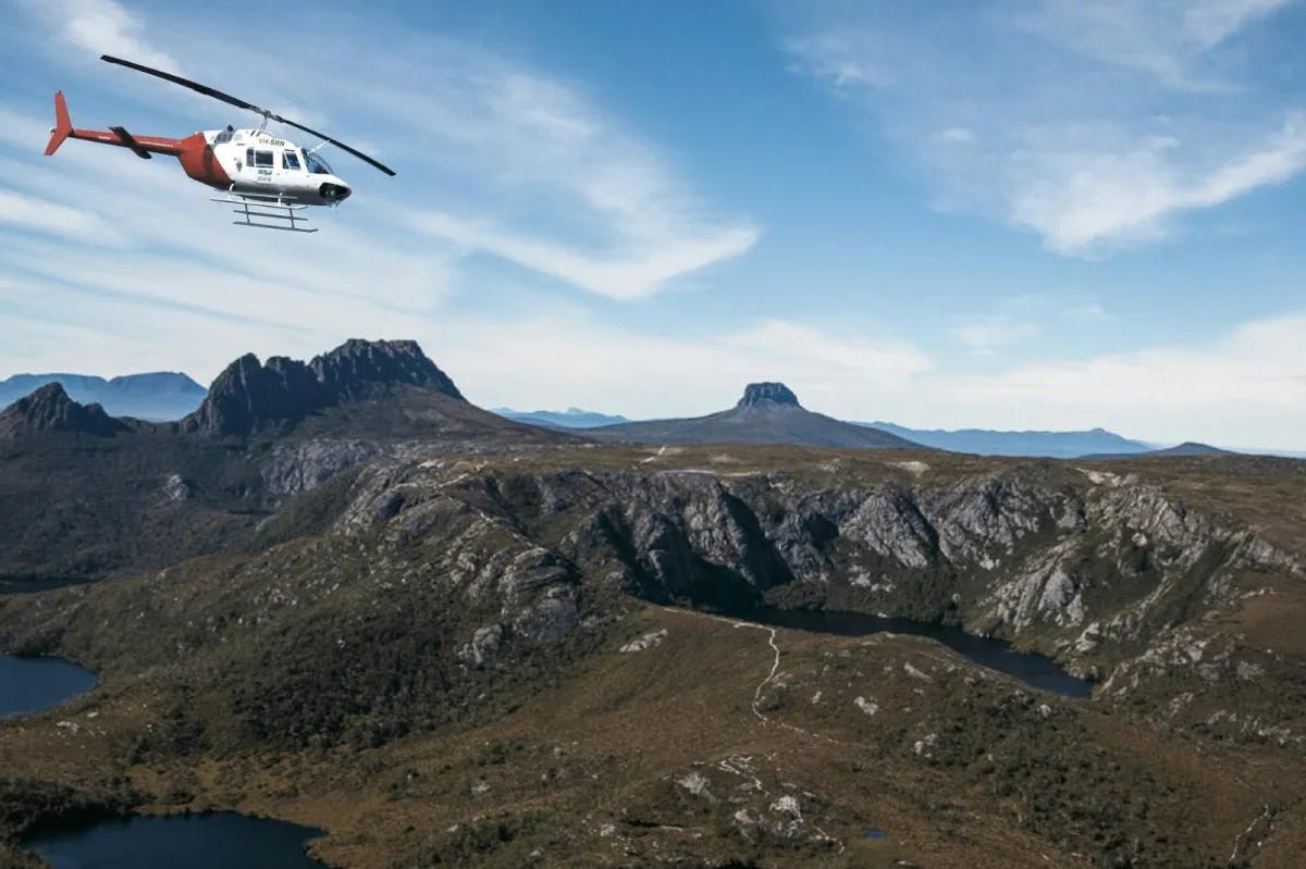 A helicopter over Cradle Mountain