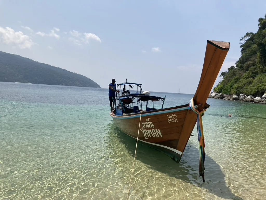 A boat in the water for your snorkeling tour. 