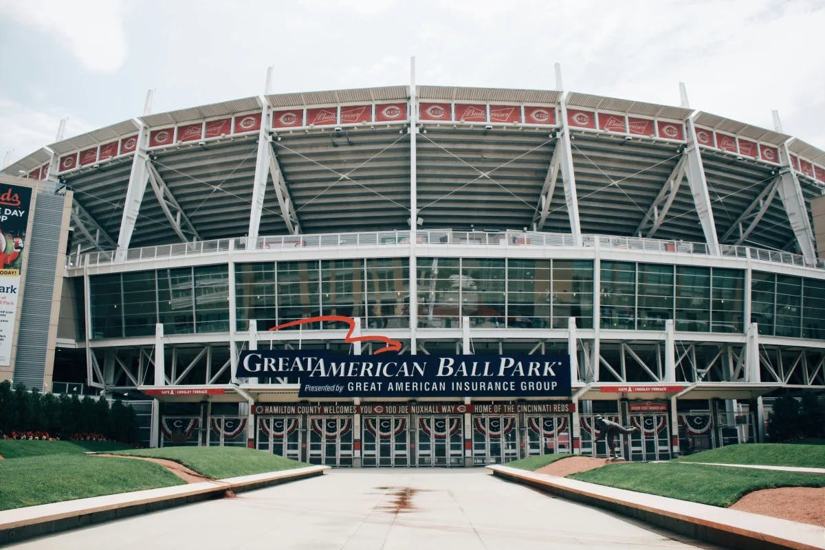 A picture of a stadium with a sign that says "Great American Ball Park" taken during the daytime.
