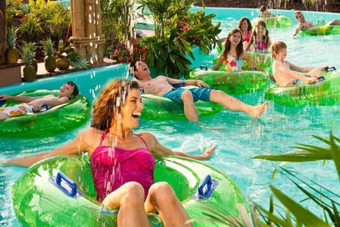 People floating on innertubes in the lazy river at White Water Branson.