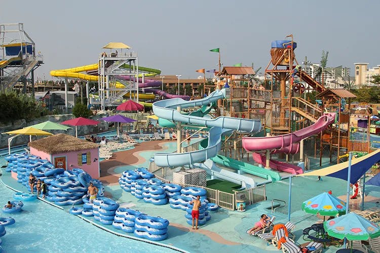 An image of colorful waterslides and umbrellas at Jolly Roger Amusement Park.