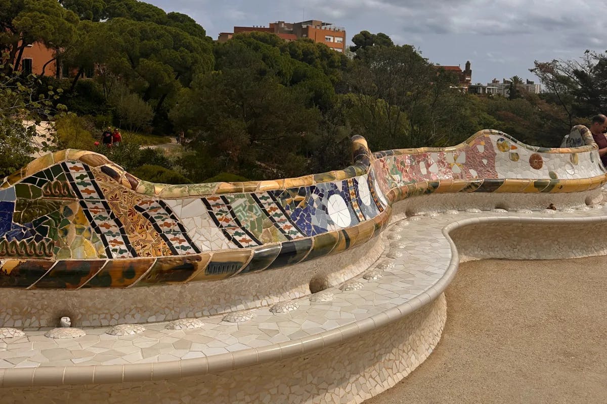 Park Guell boasts surreal architecture, colorful mosaics, and lush gardens.