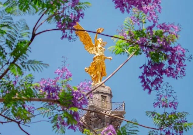 A statue of an angel on top of a tower