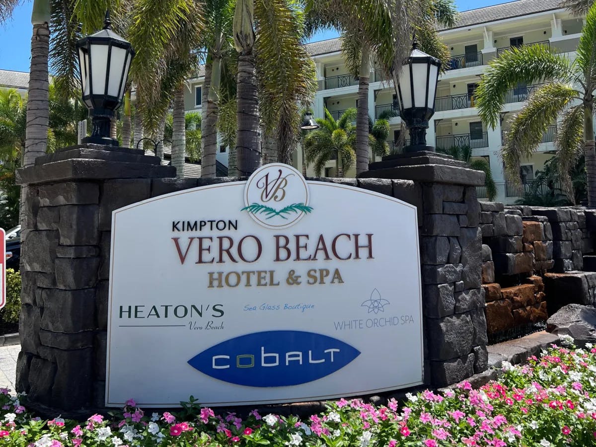 A sign outside a building that reads "Kimpton Vero Beach Hotel & Spa" 