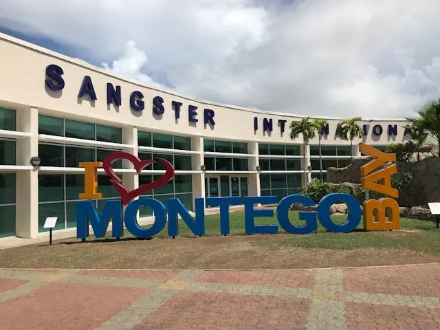 A sign reading "I love Montego Bay" outside during the daytime
