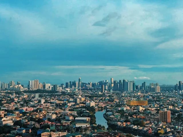 city skyline under blue sky during daytime