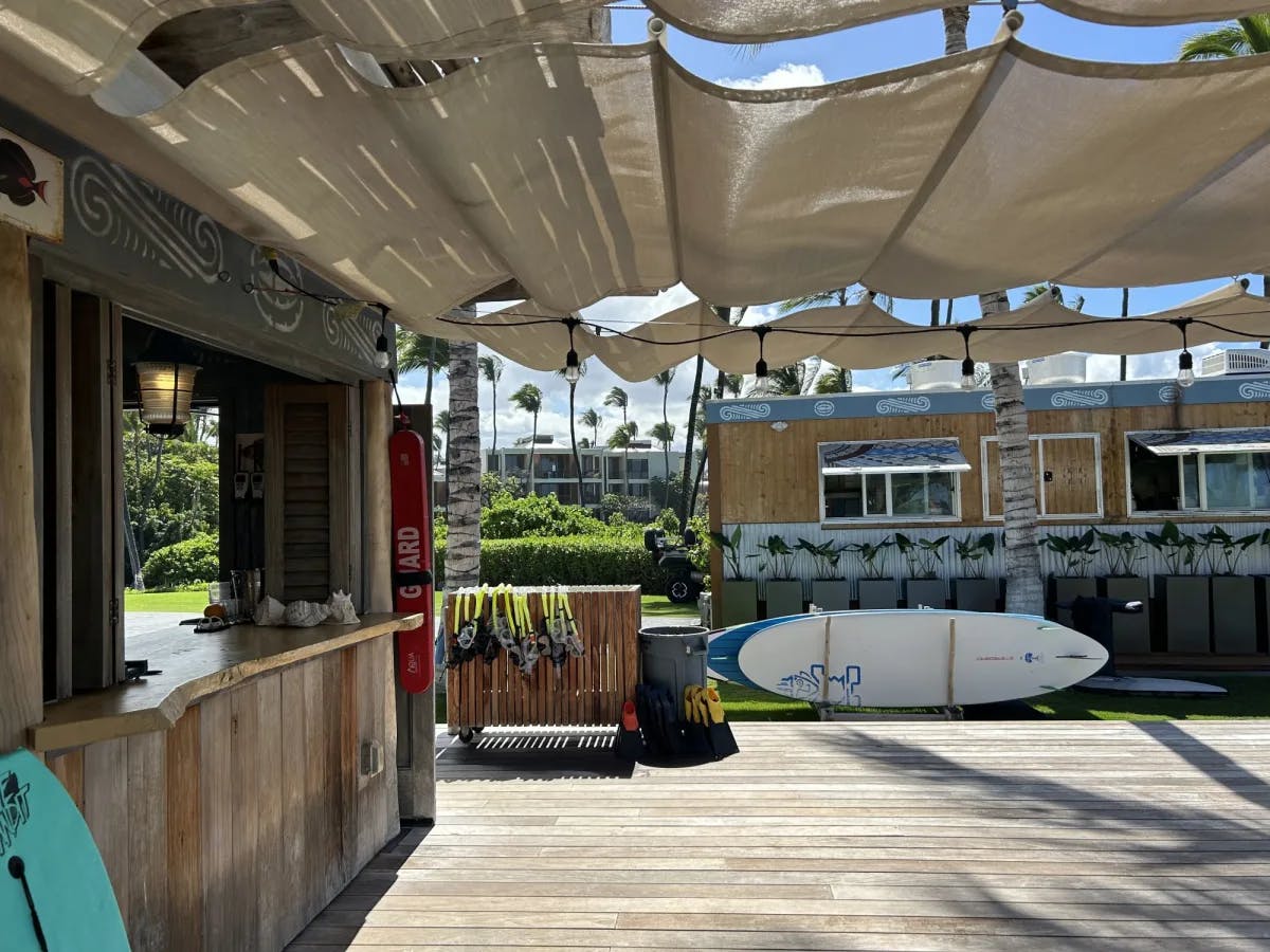 An outdoor deck area with surf boards laying about