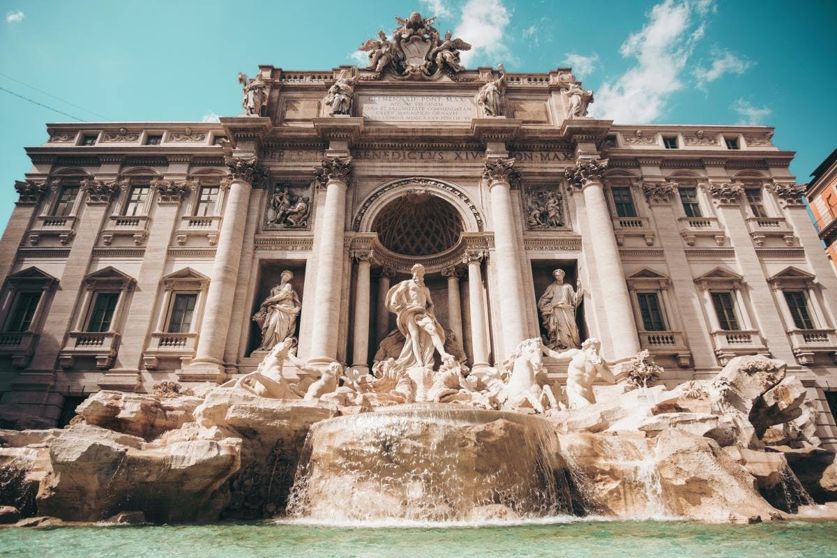 Trevi fountain in Rome from lower angel on a bright day.