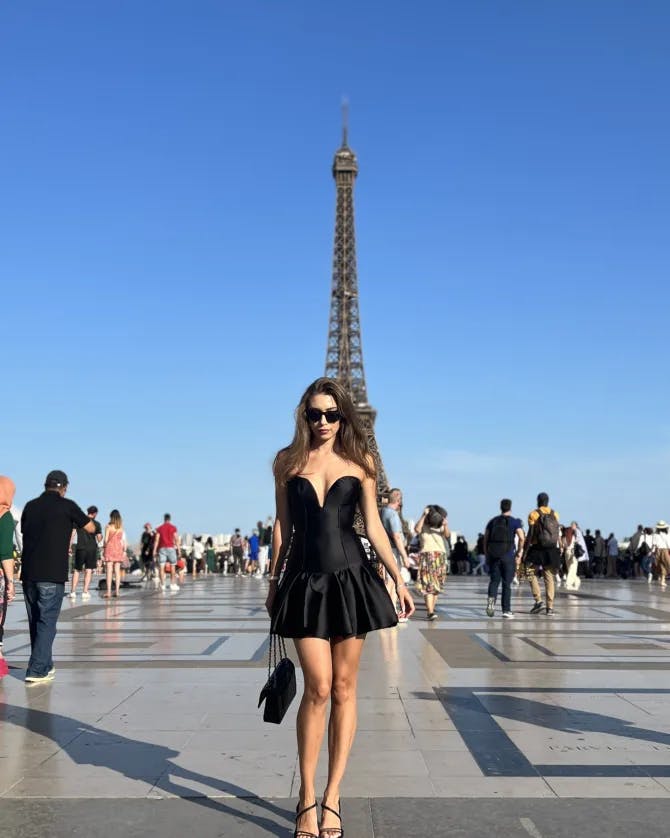 Picture of Mckenzie in black dress at Eiffle tower