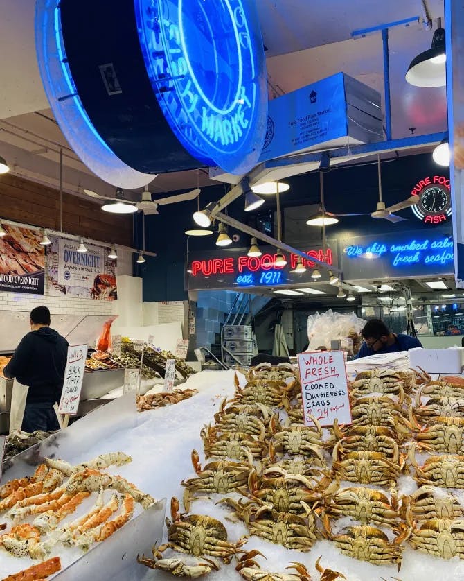 View of Pike Place Fish Market in Seattle with crabs on ice
