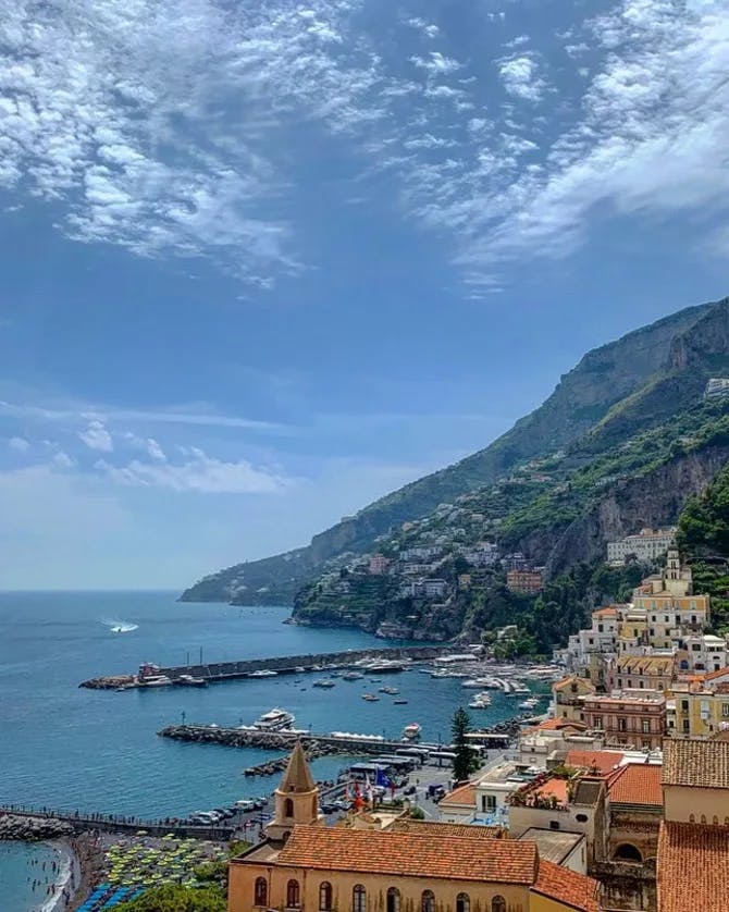 Beautiful view of an Italian town on the coast built into the hillside. 