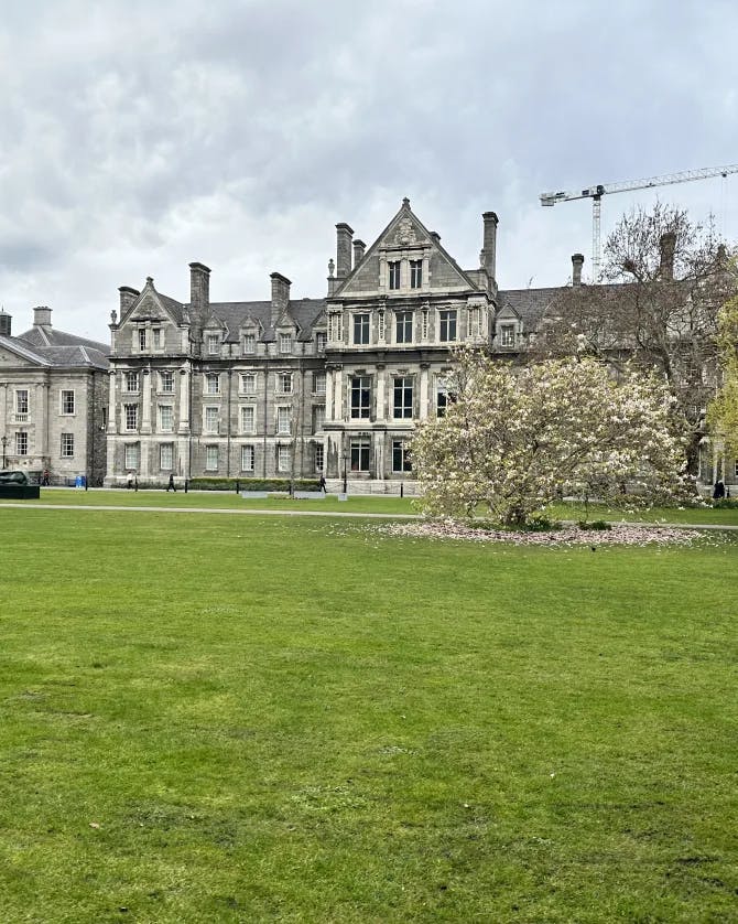 View of Trinity College Dublin with grassy surroundings