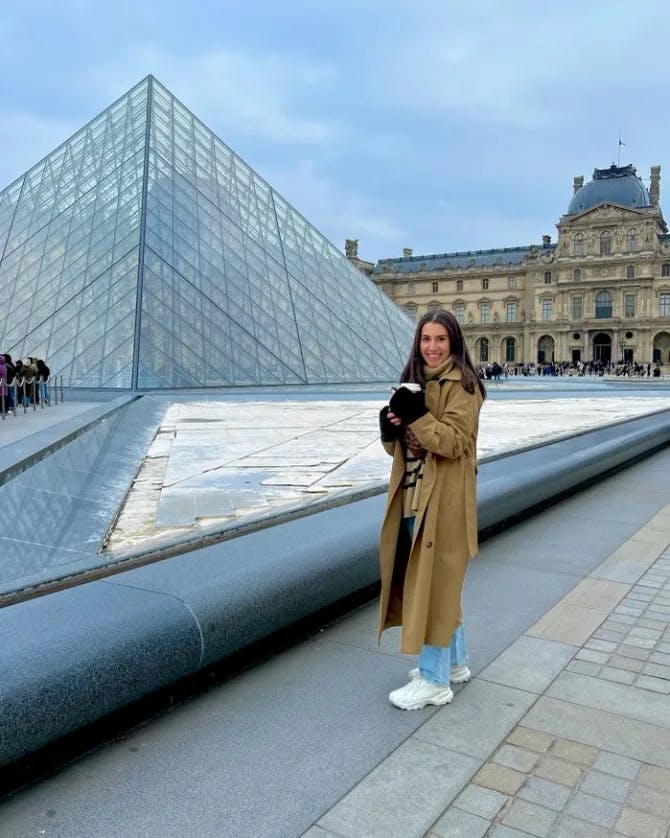 Alex posing in front of the Louvre Museum in Paris.  