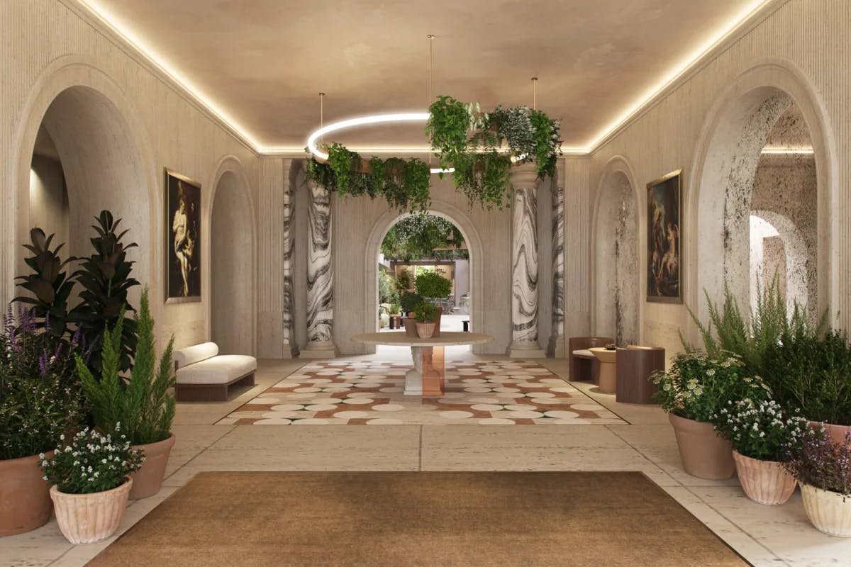 Italian entryway with marble pillars and green plants