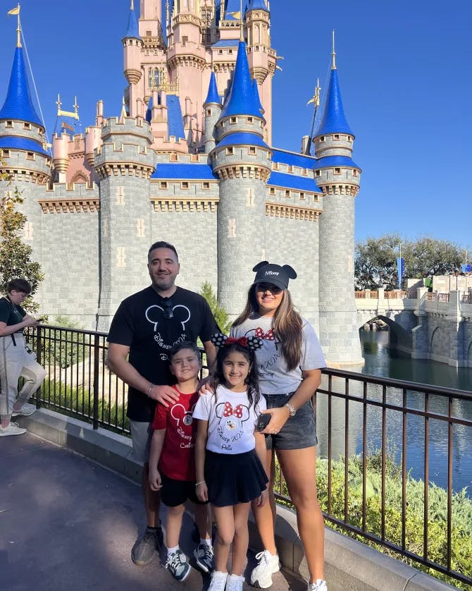 Posing for a family photo in Disney land