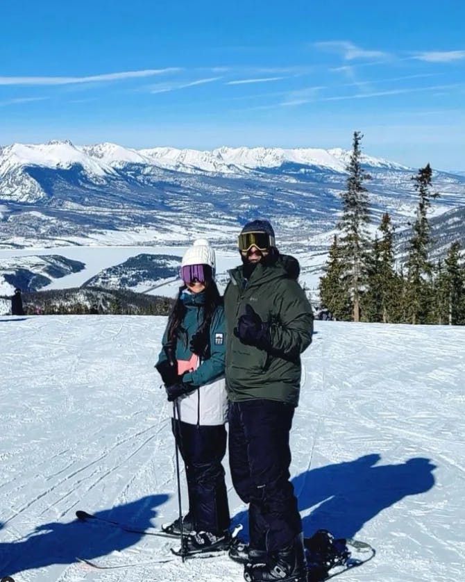 Travel advisor Amanda and companion skiing with beautiful view