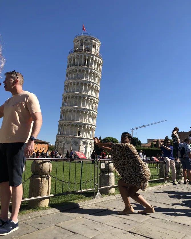 Travel advisor Charine posing with the Leaning Tower of Pisa