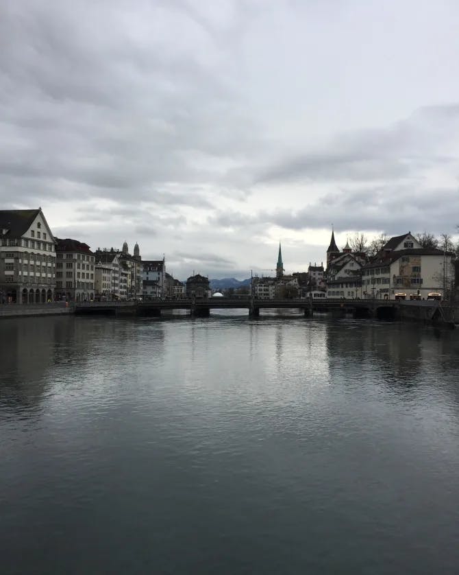 Beautiful view of a lake in Zurich with surrounding buildings