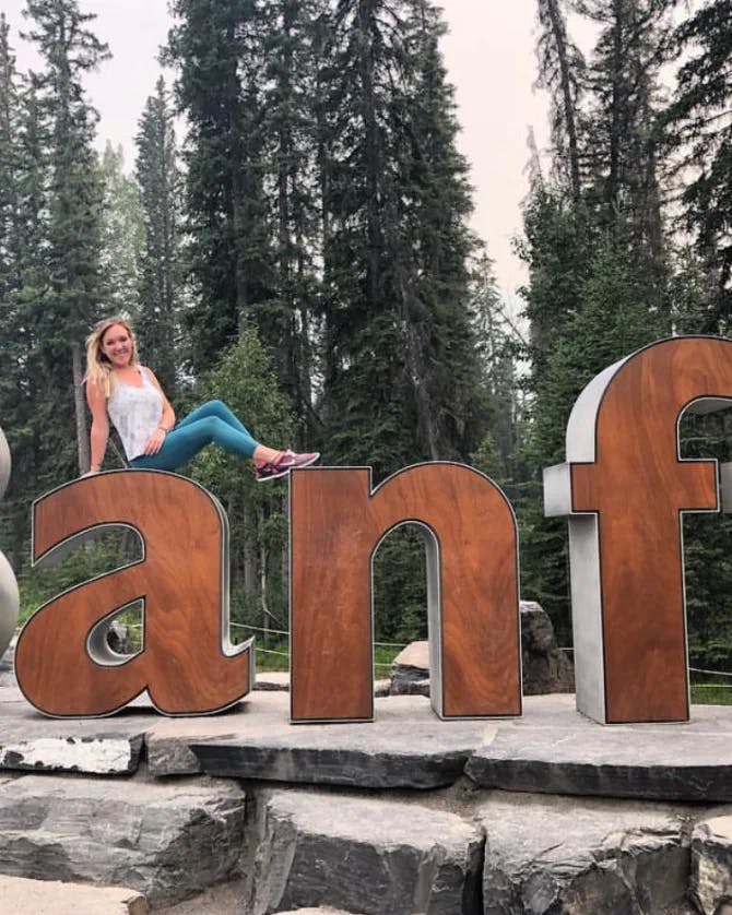 Sitting on the Banff sign
