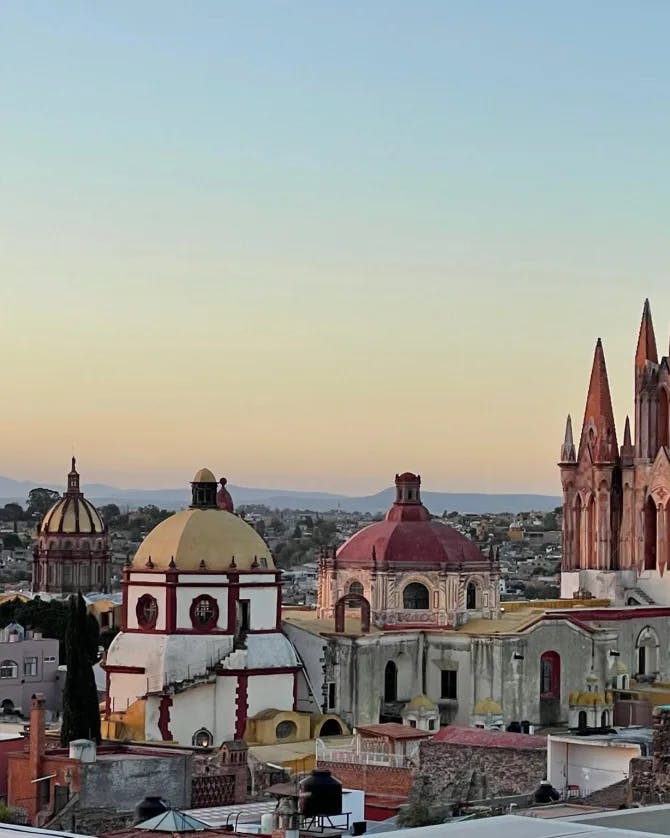 View of Parroquia de San Miguel Arcángel Church from above with dome-shaped picturesque buildings