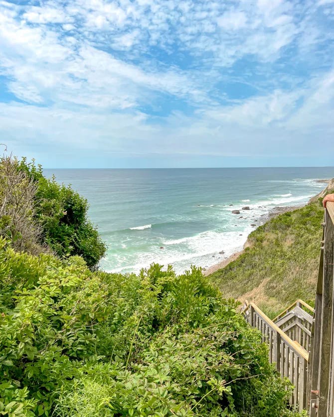 Beautiful view of stairs leading down to a beach