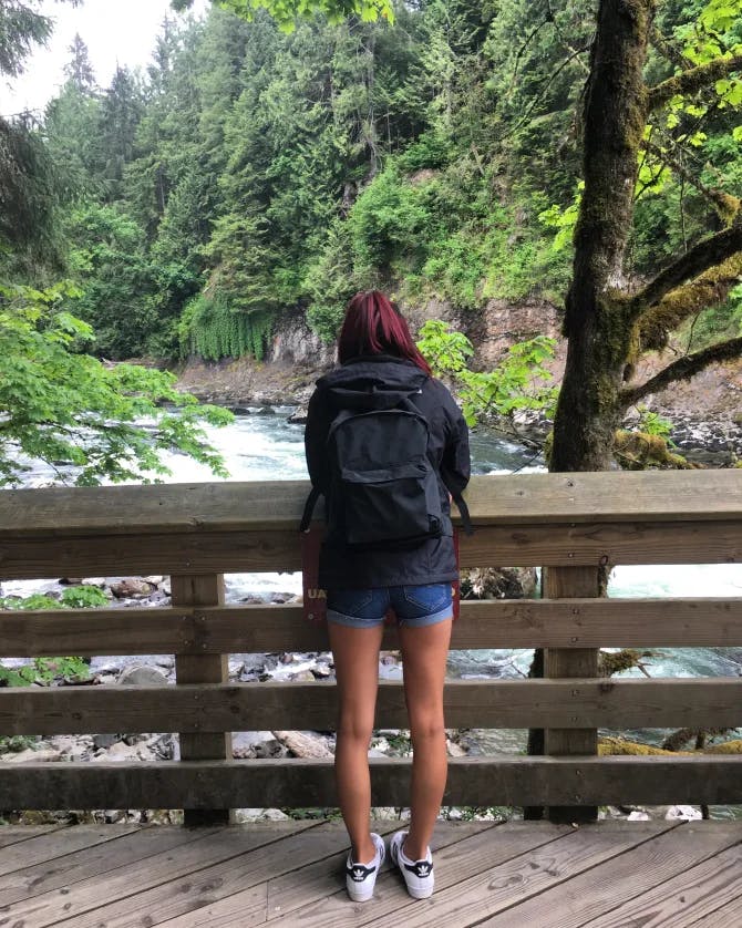 Picture of Kayla watching the river